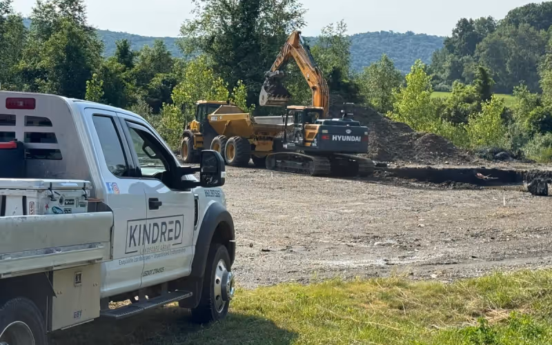 Excavation equipment and Kindred truck at an active site work project.