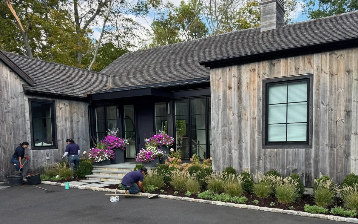 Finished planting bed and seasonal entry plantings at a residential property.
